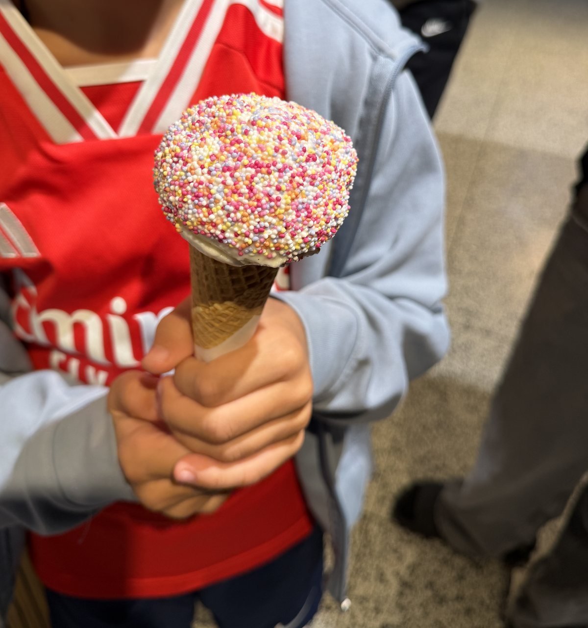 Ice cream cone rolled in sprinkles at Miska